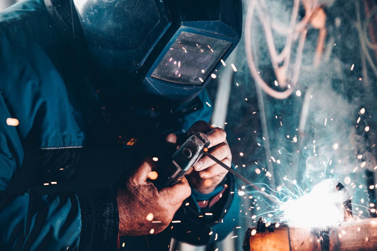 Welder fabricating steel — modular plant career path